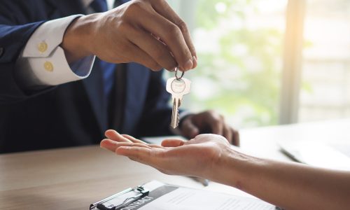 House salesmen are sending keys to new homeowners.  Buying, selling, renting, changing homes